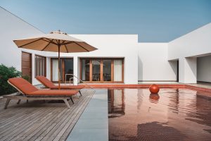 Rust-Hued Pools, Shapeless Architecture, And Dramatic Skylights In This Gujarat Home