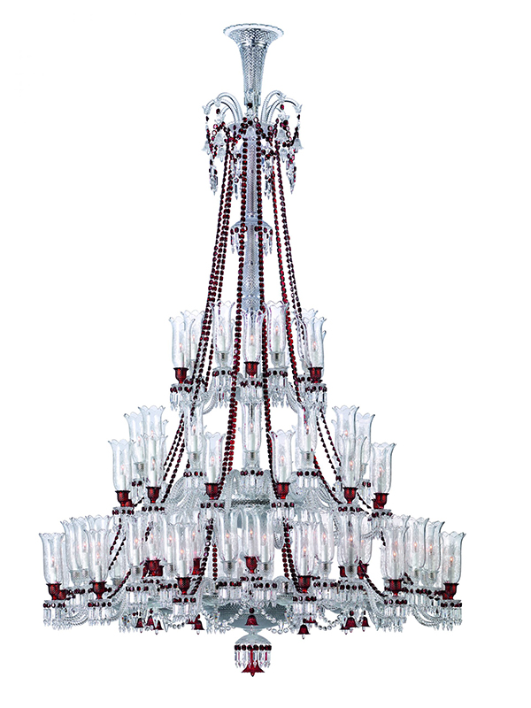 The 84-light Zénith chandelier, designed by Philippe Starck in the 19th century, has graced palaces and grand homes, with Baccarat’s signature red crystal adding a bold accent to its clear pendants. (Image Credit: Baccarat)