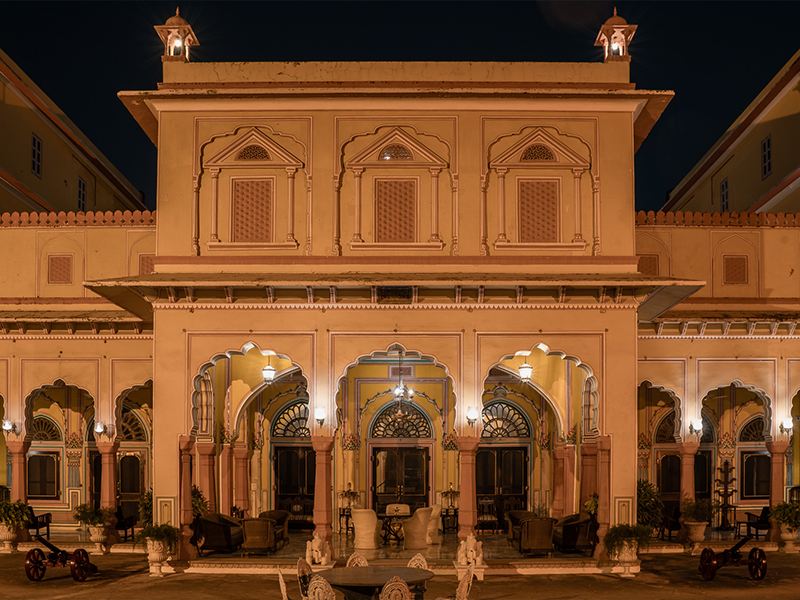 With arched corridors and relief work on the walls, the façade is a nod to Rajasthani and Mughal architectural styles. (Image Credits: Courtesy of Hotel Narain Niwas)