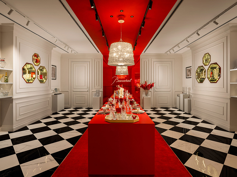 The storefront and interiors glow in Baccarat’s signature ‘golden red’—a striking hue created by adding 24-carat gold powder to molten glass, which turns red at 540°C. (Image Credit: Baccarat)