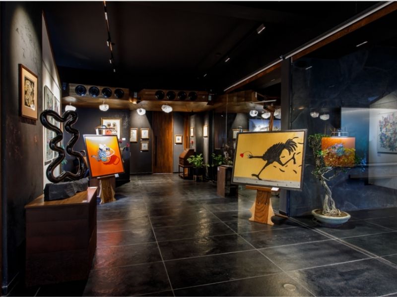 The glass partition in the gallery adds a sense of translucency to the otherwise stark palette. (Image Credits: Courtesy of IKKO)