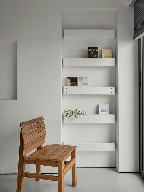 The lime-washed walls underscore the sculptural furniture by Kenneth Cobonpue in the home. (Image Credits: Isha Shah)