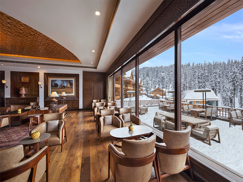 The newly revamped lounge features exquisite Khatamband ceilings and striking expressions in wood and stone, all reimagined with a refined, contemporary sensibility. ( Image Credit: The Khyber Himalayan Resort & Spa)