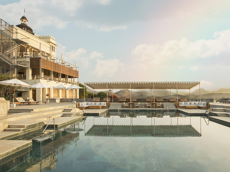 A sculptural metal staircase anchors the three-storey public wing, seamlessly linking the gym, restaurant and rooftop lounge by the pool, linking the zones. (Image Credits: Ravinder Solanki)
