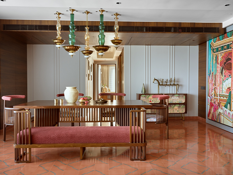 A tactile harmony of cane, repurposed teak by Hari Om Good Work, and handcrafted pendant lights by Hive by Shivangi S brings layered warmth to the dining space. (Image Credits: Retiesh Ramaiyah)