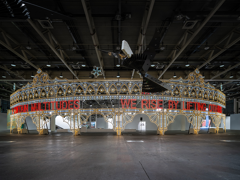 Installation view of ‘We Rise By Lifting Others’ by Marinella Senatore, LED bulbs and Flex LED on a wooden structure, 2023 (Image Credits: Mazen Jannoun, Image Courtesy: Mazzoleni and the artist)