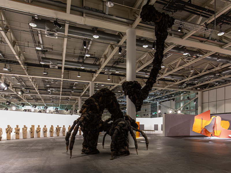 Installation view of ‘Danse Macabre’ by Nicola Turner at Art Basel Unlimited, Truss structure supporting tendrils of wool and horsehair with vintage furniture legs, 2025 (Image Credits: Annely Juda Fine Art and the artist)
