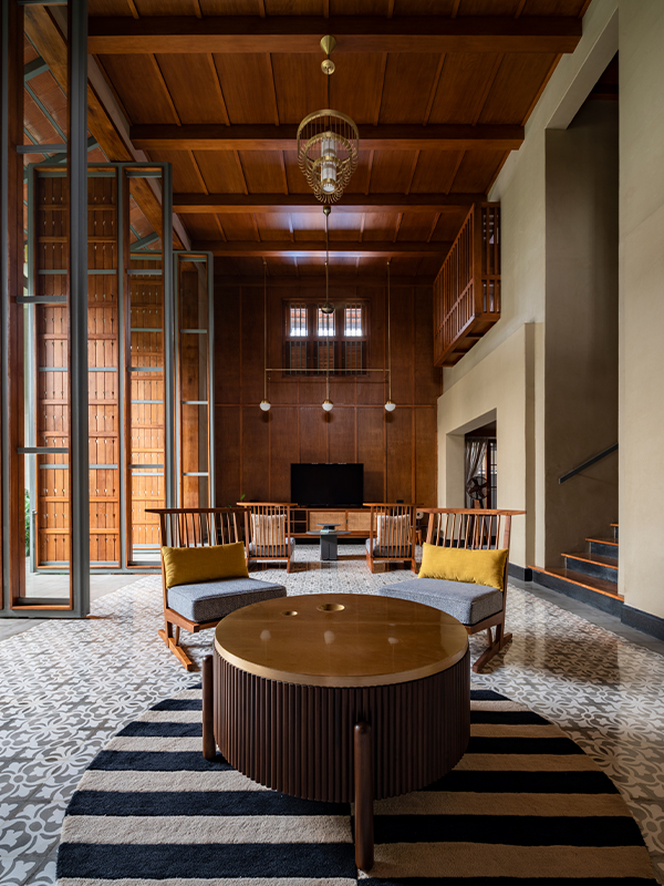 The EPJ Residence features Kerala teak furniture and timber flooring reflecting understated elegance. (Image Credits: Roy Antony Architects)