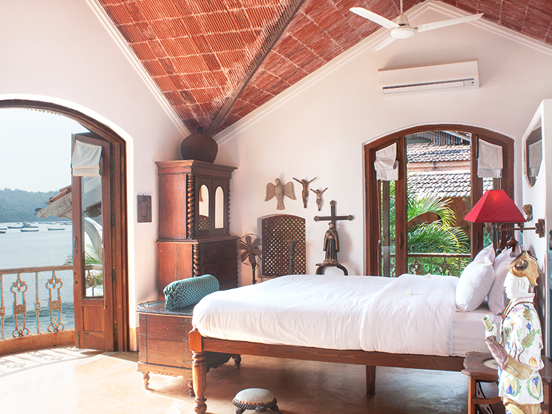The Mangalore tiled sloping roof, wooden accents paired with arches leading to endless views, almost blur the boundaries between the sea and the property. (Image Credits: Courtesy of Ahilya by the Sea)