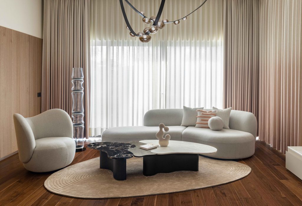 The master bedroom is a tapestry of Japandi origins. Bespoke curtains by Creative Wonders and a rug from Prince Home Furnishing, alongside carefully sourced furniture and statement dewdrop lighting (inspired by BOMMA) from China, add layers of cohesion to the space. (Image Credits: Purnesh Dev Nikhanj)