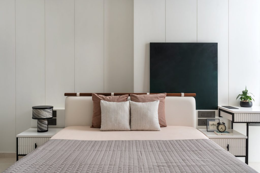 Muted and modern, the daughter’s room boasts plush bedding from Rearrange and a marble-grained table lamp from Name Place Animal Thing. (Image Credits: Biju Gopal)