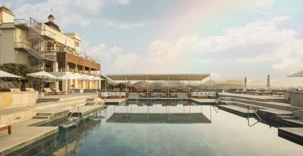 A sculptural metal staircase anchors the three-storey public wing, seamlessly linking the gym, restaurant and rooftop lounge by the pool, linking the zones. (Image Credits: Ravinder Solanki)