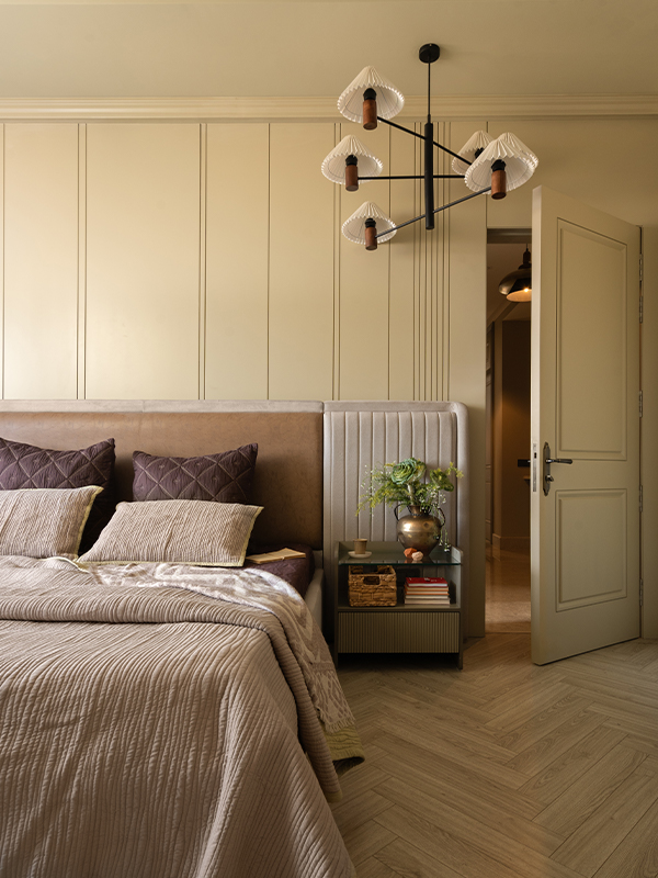 The Fanny Chandelier by Orange Street is a delicate balance of crisp pleats and classic curves in the master bedroom. (Image Credits: Tarang Goyal)