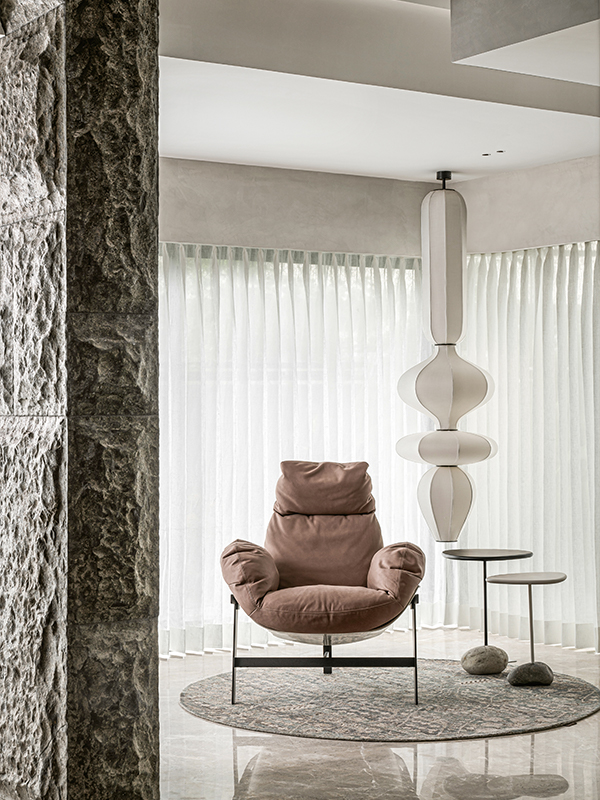 The beautiful Morph light by Olie softens a reading nook with its gentle curves. (Image Credits: Nayan Soni)