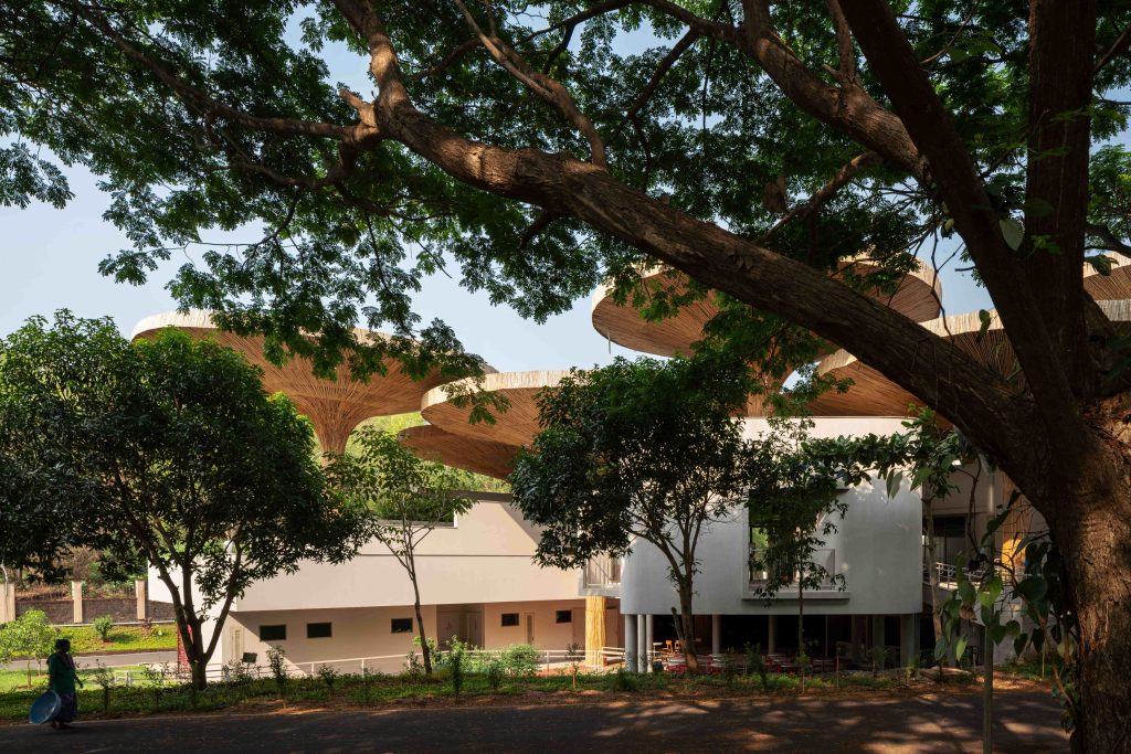 The parasol-like bamboo canopy reimagines the terrace as a shaded social commons, merging craft with climate-conscious design. (Image Credits: Suryan//Dang)
