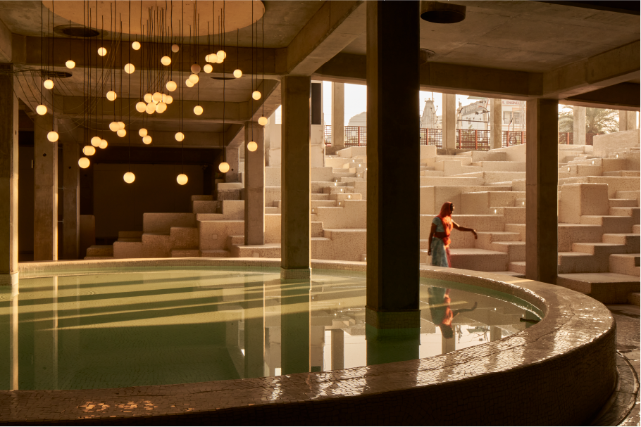 A central stage with stepped seating invites performances, fostering fluid, community-driven interaction. (Image Credits: Edmund Sumner) 