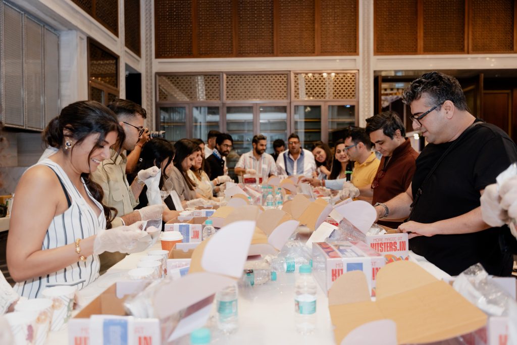 A candid glimpse from the fun tile-making session with Firdaus Variava at The Great Room, featuring Esha Gupta and Chirag Dewan enjoying the creative process. (Image Credits: Design Pataki)