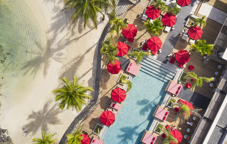 From a sunlit bar and poolside daybeds to hidden lounges, Beach Rouge shifts from relaxed dining by day to a DJ-led beach club by night. (Image Credit: Tom Fallon)