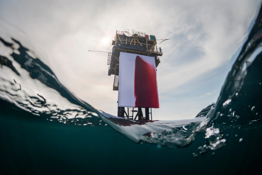 Anish Kapoor’s ‘BUTCHERED’ transforms the Skiff gas platform into a striking stage for climate protest. (Image Credits: Greenpeace)
