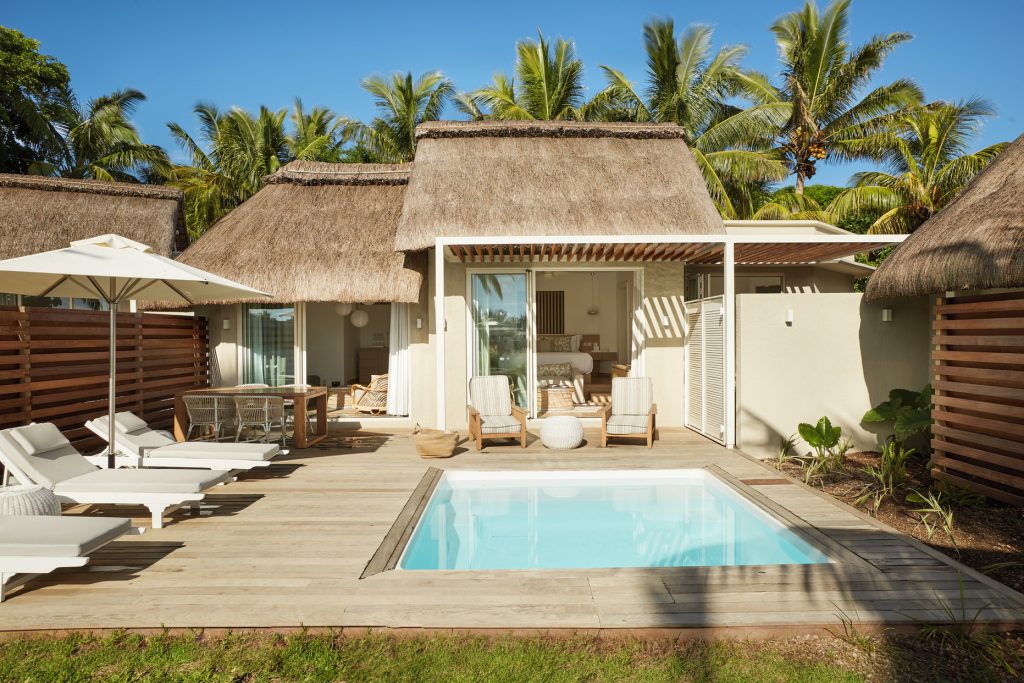 Tucked away from the resort’s lively hum, the Ocean Villa is a serene two-bedroom retreat with its own pool, sun deck, and lush tropical bathrooms. A soft neutral palette with hints of sea green flows through the 100-sqm space, while manicured gardens open to uninterrupted Indian Ocean views. (Image Credit: LUX* Grand Gaube)