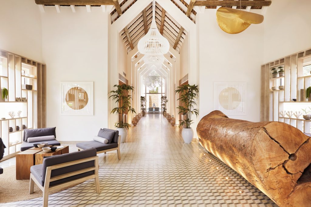 The spa features a statement live-edge desk that blends seamlessly with the honey-hued ambience. (Image Credit: LUX* Grand Gaube)