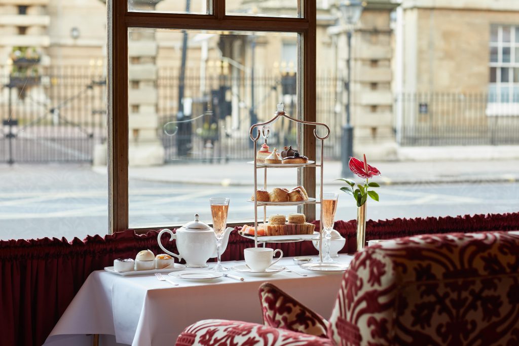 The timeless British tradition of afternoon tea is elevated at The Rubens at the Palace, served with unrivalled views of Buckingham Palace—and made even more indulgent with a complimentary glass of Prosecco. (Image Credit: Rubens At The Palace)