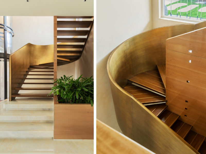 A sculptural brass staircase sweeps upward in a fluid curve towards the terrace lounge, reflecting light and anchoring the home with quiet architectural drama. (Image Credits: Gitesh Gupta, Studio Bluora)