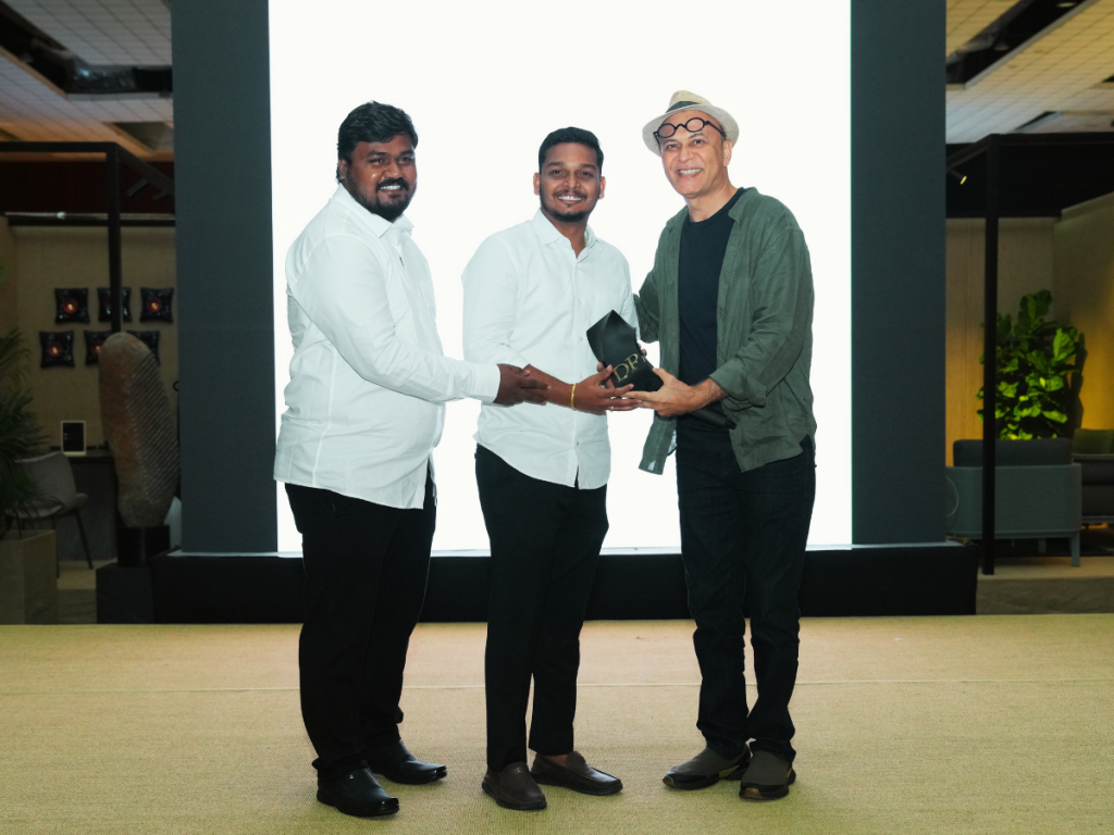 Puran Kumar of Studio PKA presented the Social Impact and Community Projects Award to Ar. Yedla Surender and Ar. Geaupally Manish of Iksha Design Collectives. (Image Credits: Design Pataki) 