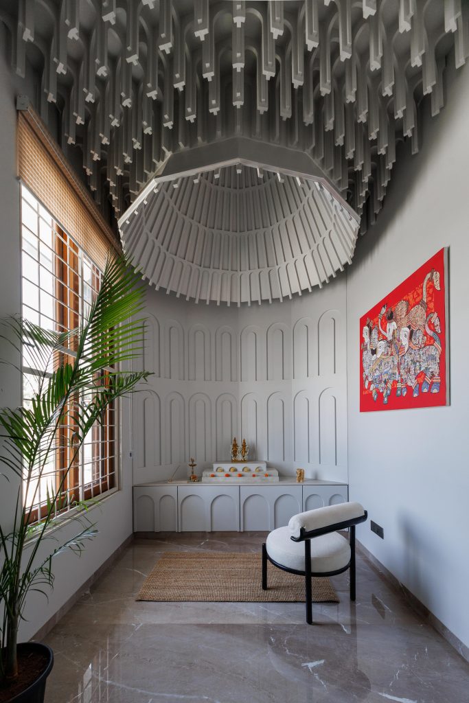 A contemporary pooja room that pays homage to India's rich temple heritage through its architectural expression. (Image Credits: Vivekajeet Purohit) 