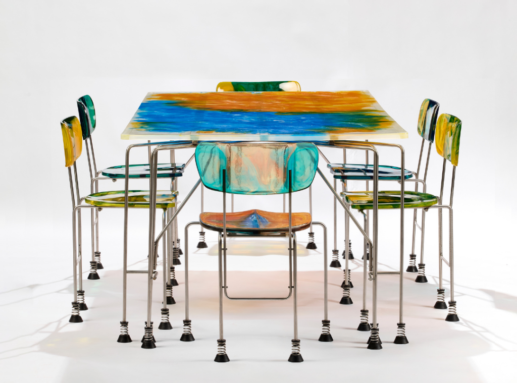 Gaetano Pesce’s ‘Broadway’ dining set (1993) pairs a vibrant table with six spring-mounted chairs, merging playful movement, bold colour, and sculptural design into a rare, expressive ensemble. (Image Credits: Alexis Narodetzky) 
