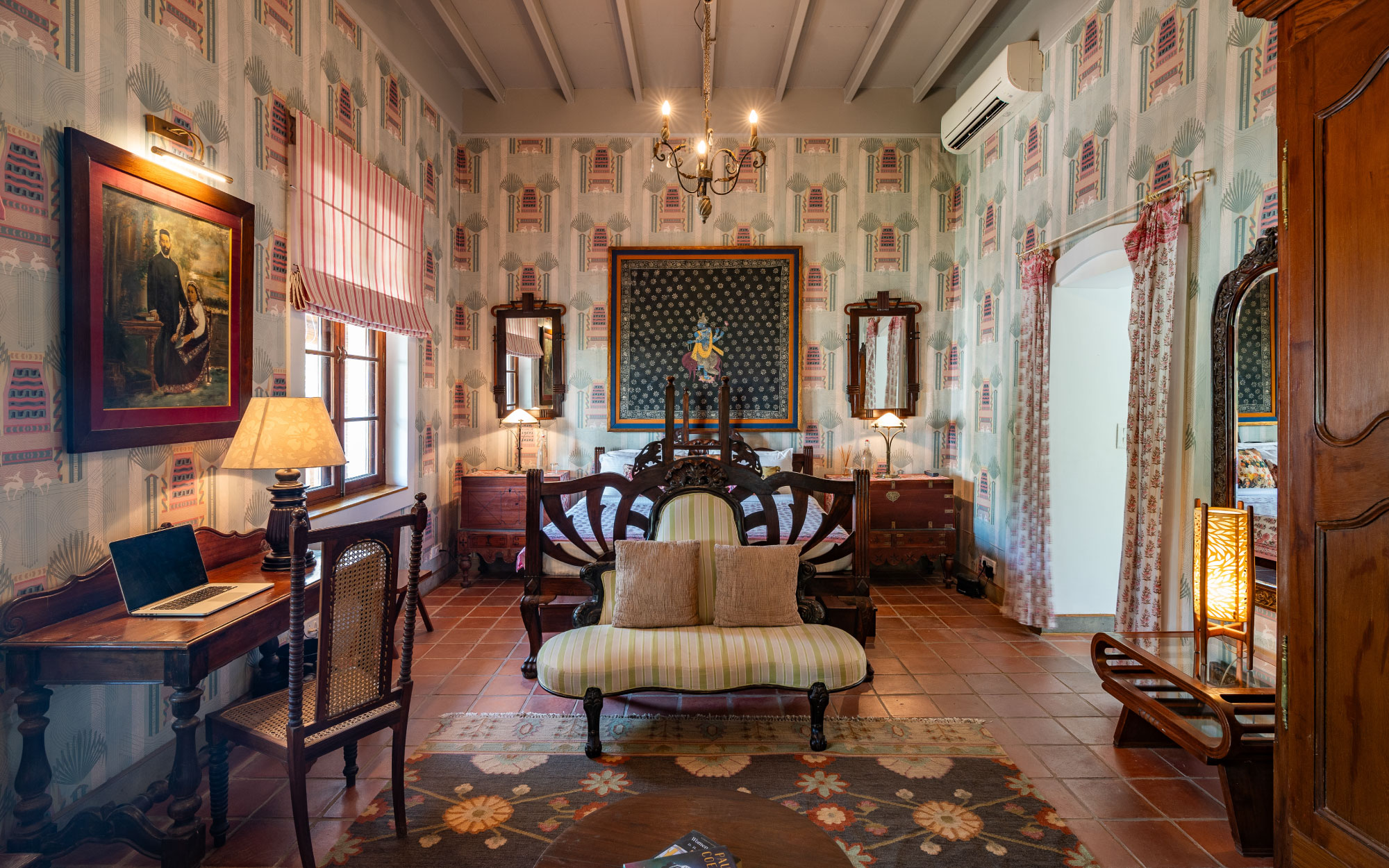 With vintage furniture, art deco frames, and mint green Dhanraj Mahal wallpaper, the Bombay Suite is a portal to colonial era Bombay. (Image Credit: Maison 26)