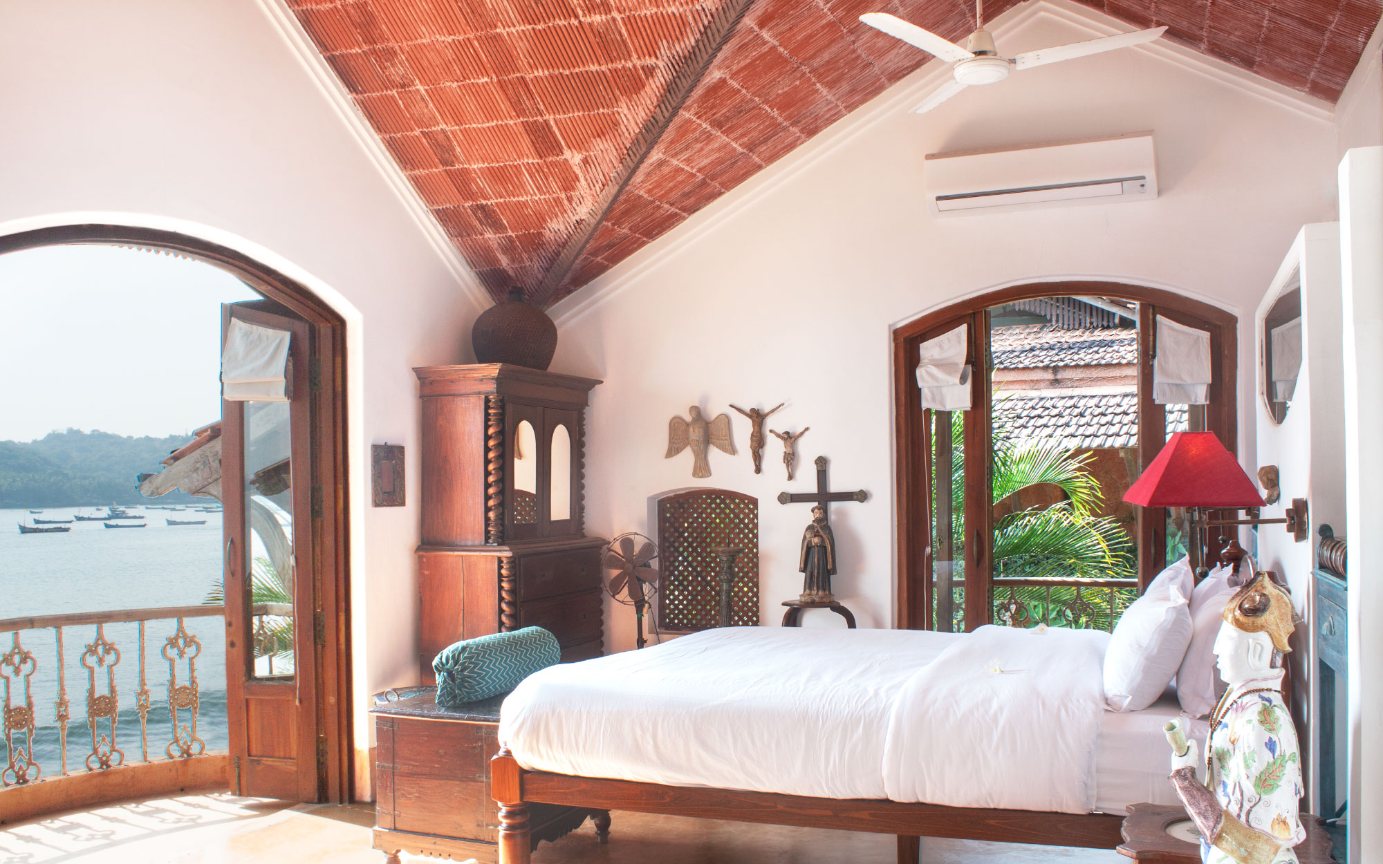 The Mangalore tiled sloping roof, wooden accents paired with arches leading to endless views, almost blur the boundaries between the sea and the property. (Image Credits: Courtesy of Ahilya by the Sea)