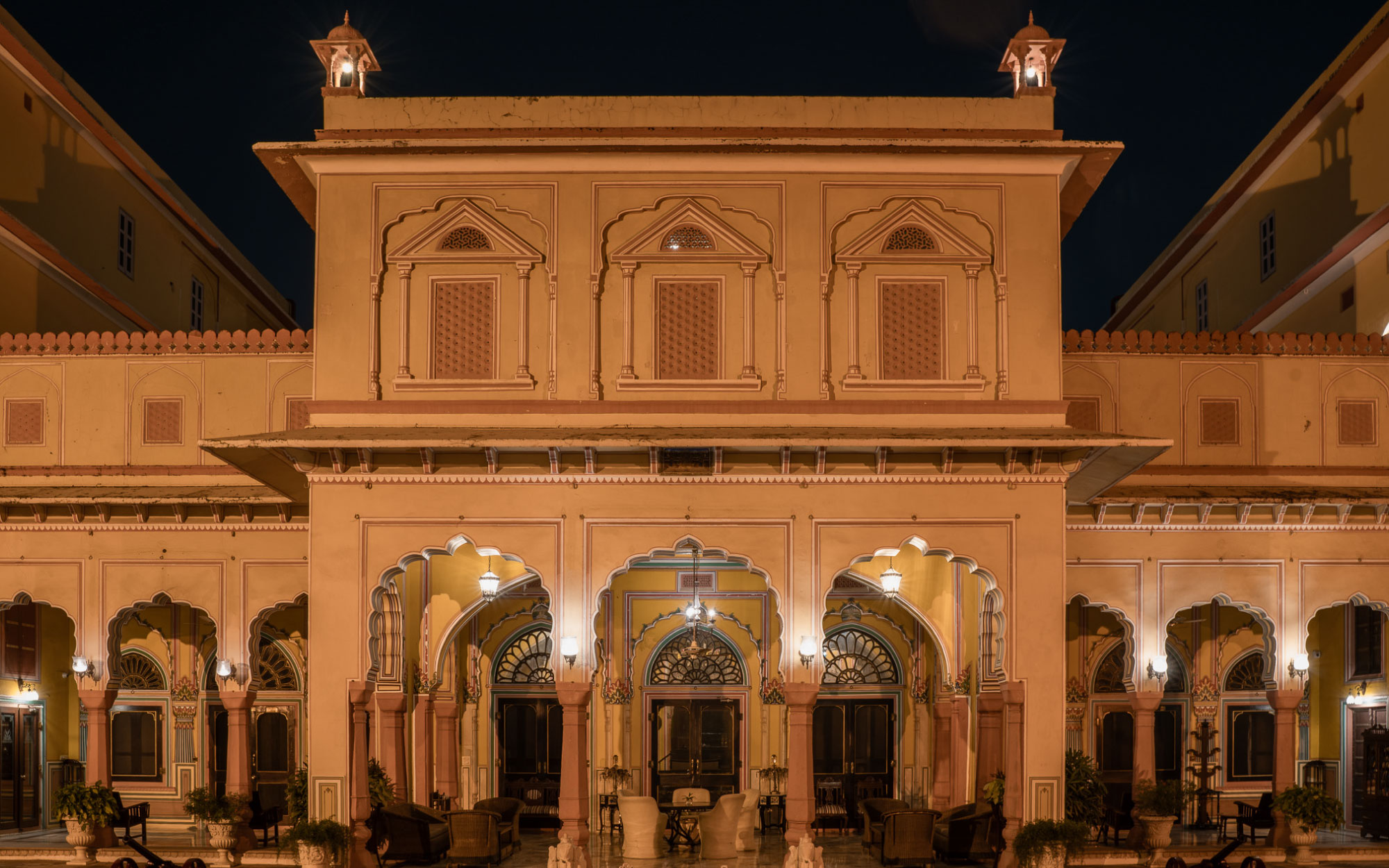 With arched corridors and relief work on the walls, the façade is a nod to Rajasthani and Mughal architectural styles. (Image Credits: Courtesy of Hotel Narain Niwas)