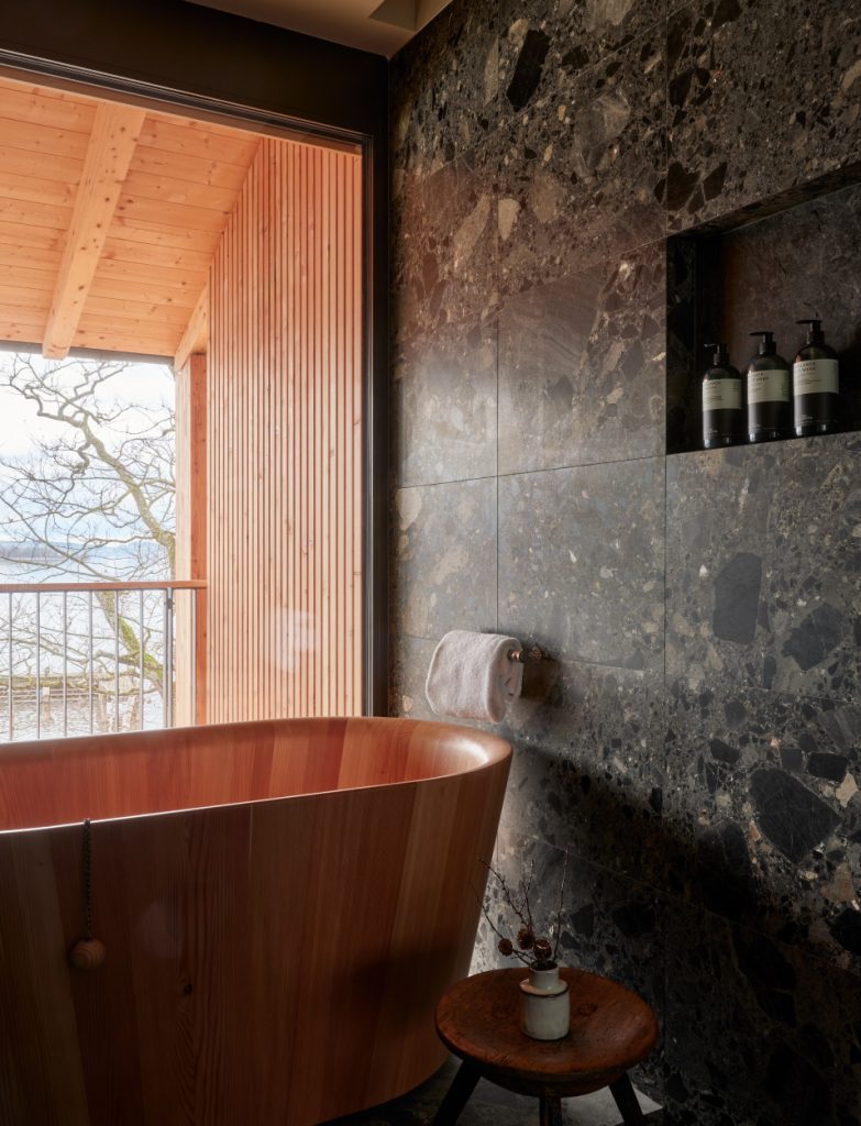 With its relaxed, country-chic aesthetic, each suite features a Japanese larch wood soaking tub—an understated luxury that frames serene lake views. (Image Credit: Elias Hassos)
