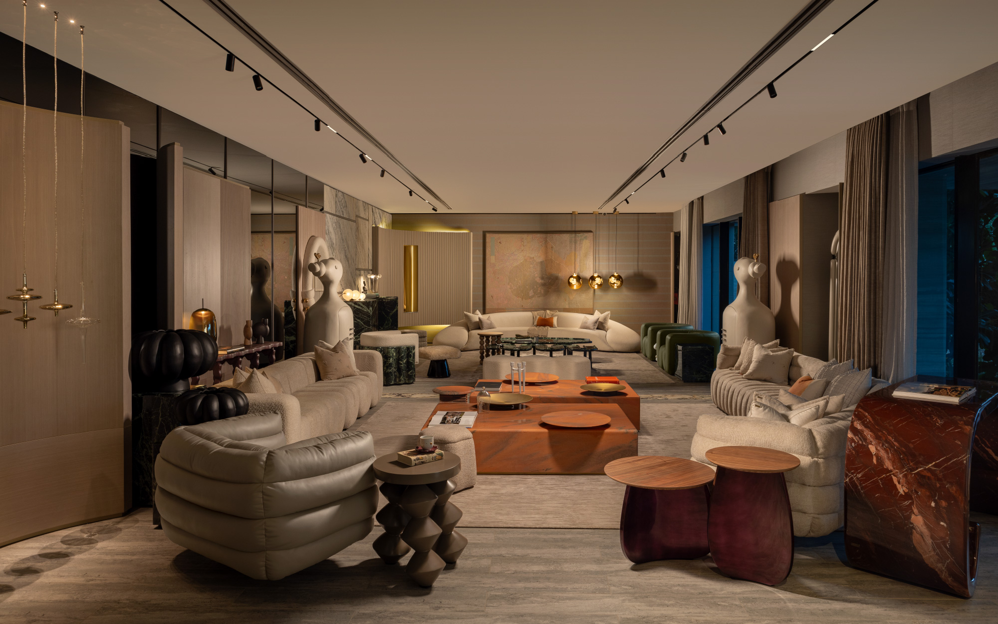 The ground floor features two living rooms with homeware products designed by Essentia Environments. (Image credit: Essentia Environments)