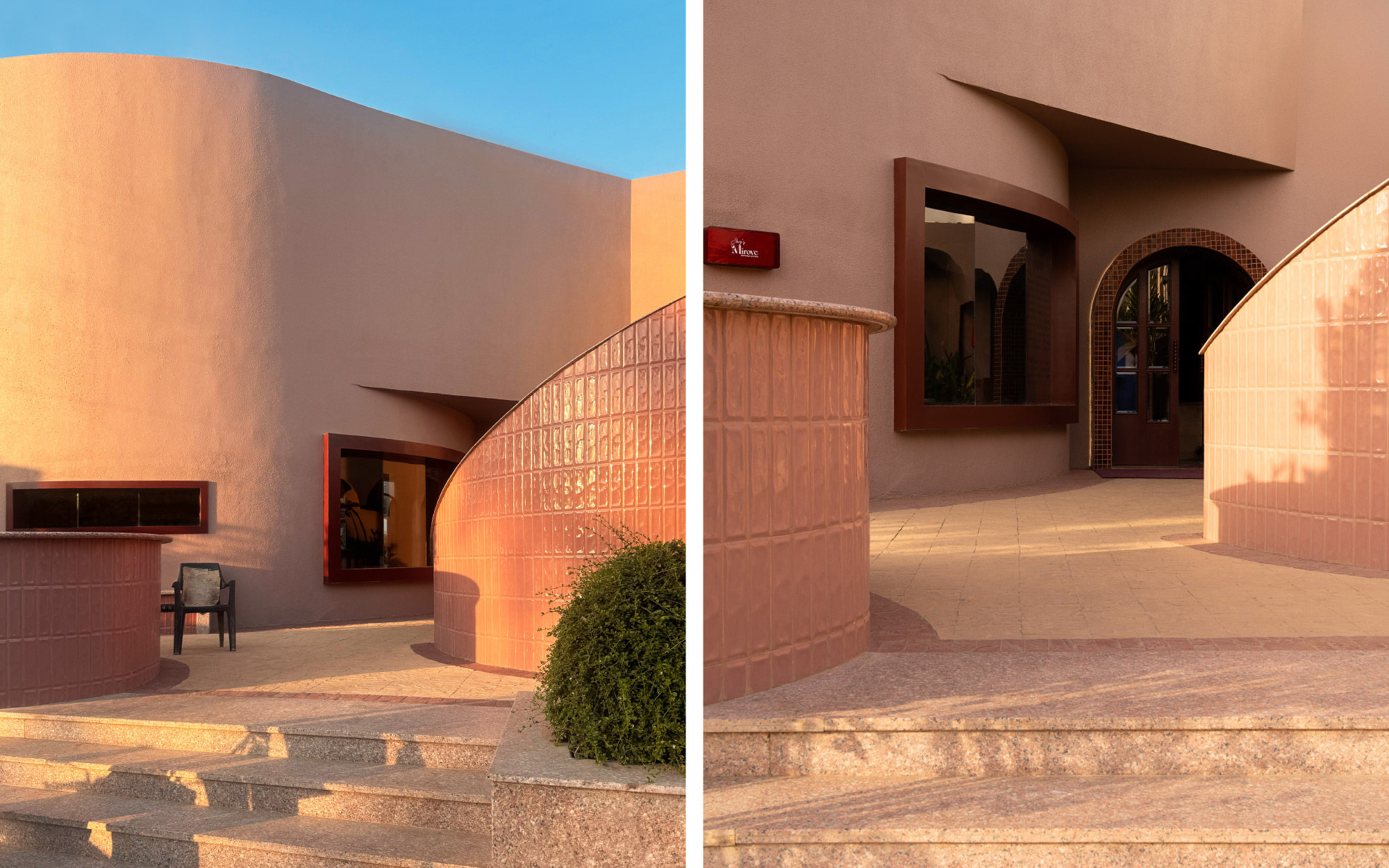 Left: The sculptural façade, cast in muted rouge concrete, curves like a monolith softened by sunlight, serving as a modern reinterpretation of Jaipur’s pink identity. Right: Thickened window frames and tiled thresholds heighten the sense of arrival, carving the façade into bold, architectural gestures. (Image Credits: Avesh Gaur)