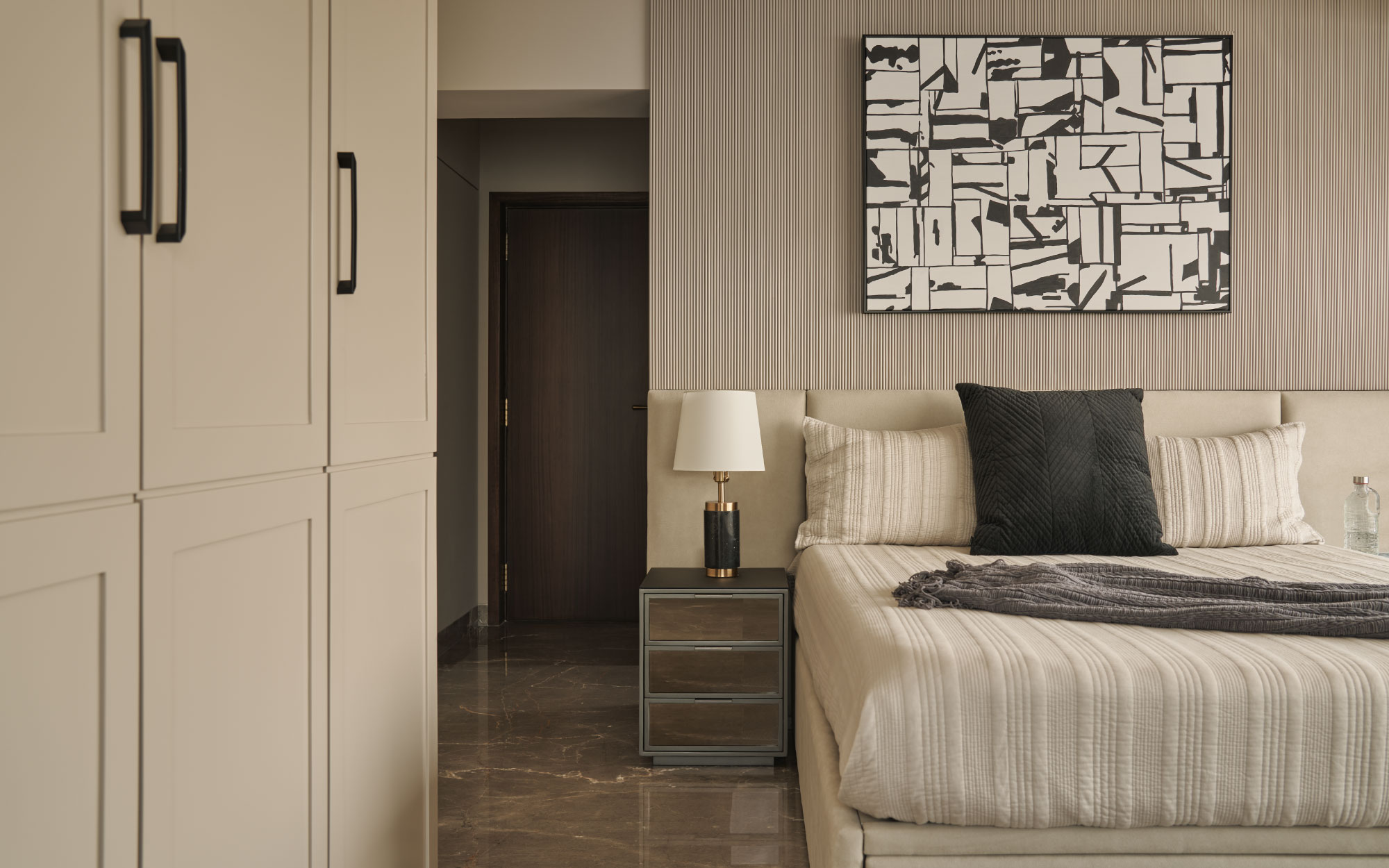 Fluted walls, glossy Armani grey marble flooring and neutrals in varying shades of ivory and sand respond to light in a rhythmic manner in the son’s bedroom. (Image Credits: Yadnyesh Joshi)