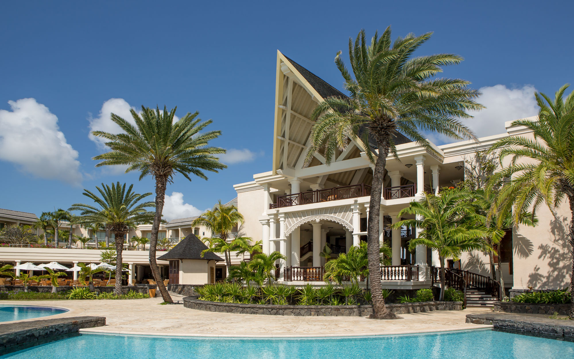 The main building boasts truss roofs, interlaced with robust timber bracing — an elegant nod to the enduring craftsmanship of colonial Creole architecture. (Image Credit: Residence Mauritius)