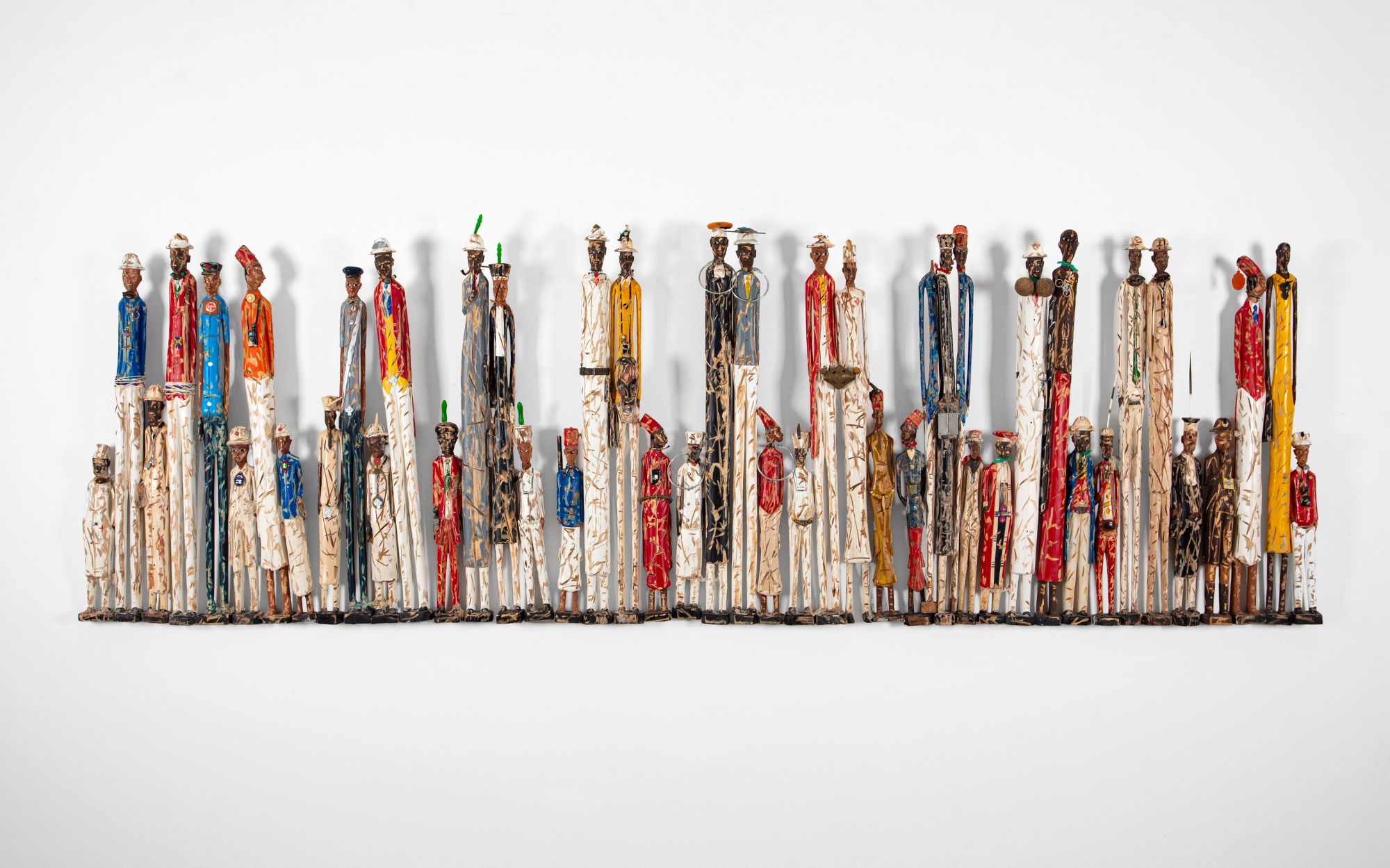 Les Ecorchés by Pascale Marthine Tayou, wood and metal, 107 x 324 x 14 cm (Image Credits: Photographer Duccio Benvenuti/Art Store © ADAGP, Paris 2025, Pascale Marthine Tayou, and Galleria Continua) 