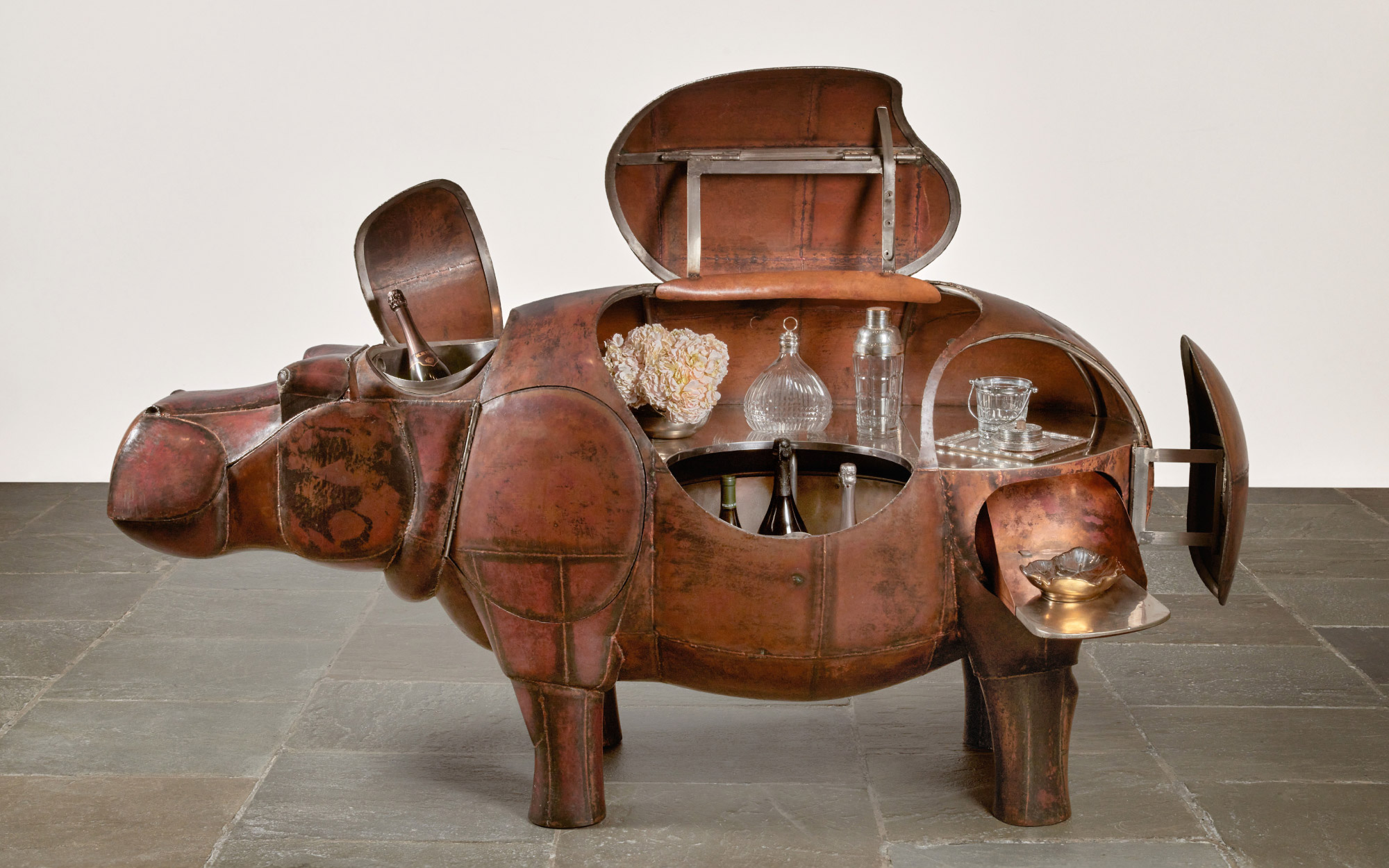 The mechanism of the Hippopotame Bar allows multiple partitions to serve an aesthetic and functional purpose while hosting. (Image Credits: Sotheby’s)