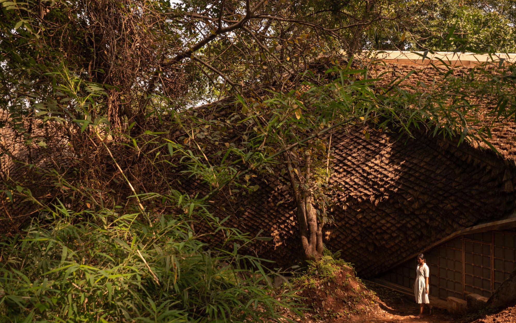 It settles into the terrain with quiet grace, resting on the land without disturbing its natural rhythm. (Image Credits: Studio IKSHA)