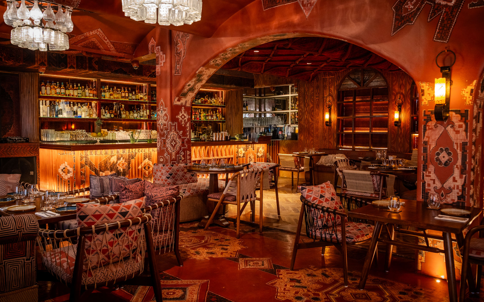 Textiles envelop the interiors, flowing seamlessly across walls, ceilings, and furnishings.(Image Credit: Ammakai)