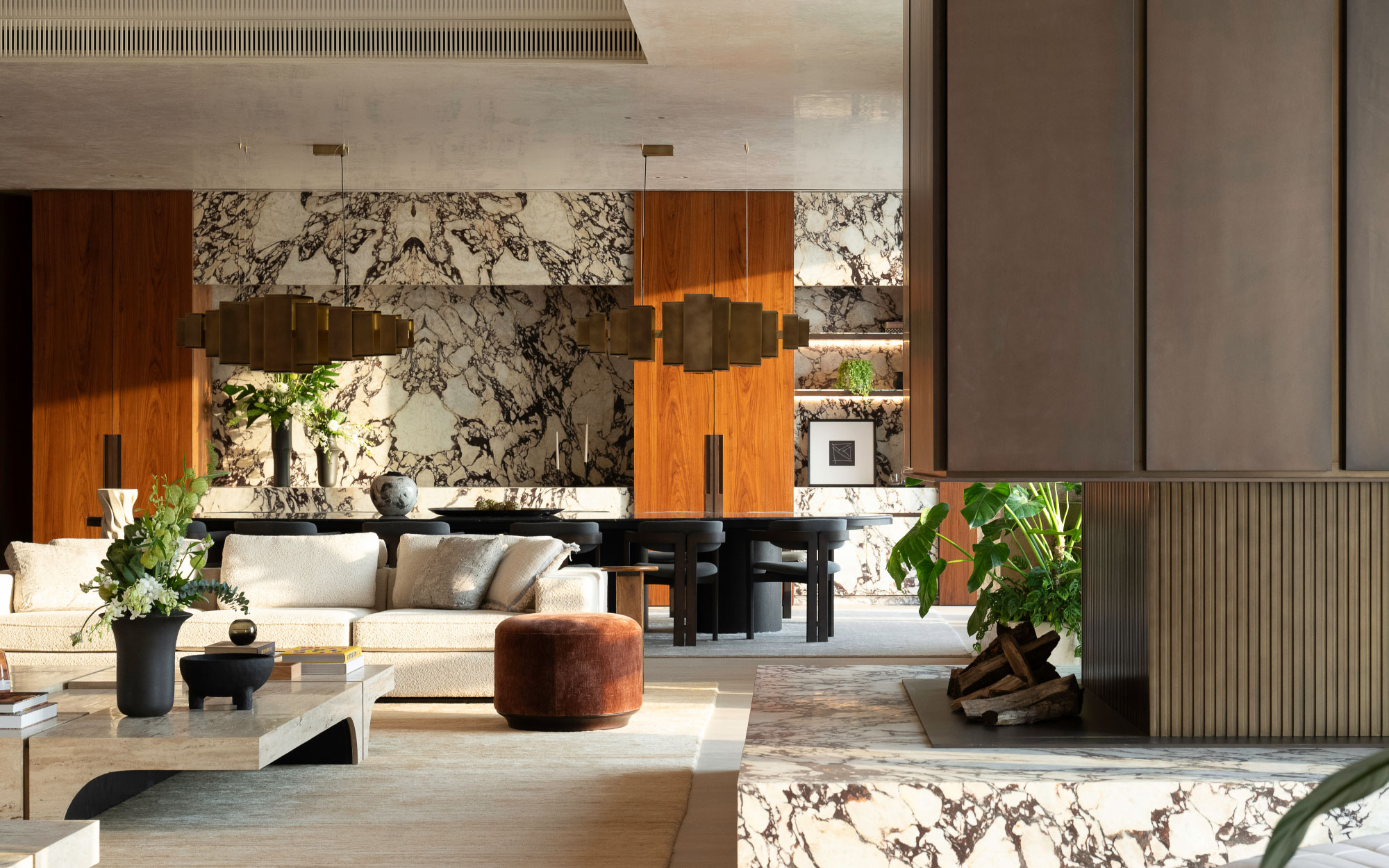 A high-gloss recessed ceiling in the living space quietly mirrors the city below, catching fragments of the skyline and the ever-changing shift of light. Much of the furniture was custom-made in this space. (Image Credit: Patricia Goijens)