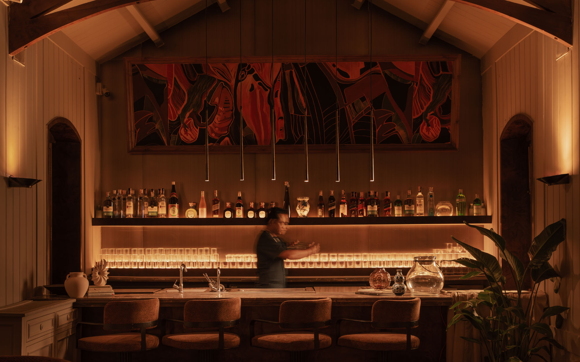 The private bar-dining room offers a more intimate experience —defined by exposed wooden rafters and a sculptural circular corner that lends both warmth and architectural focus. (Image Credit: Oju Colaba)