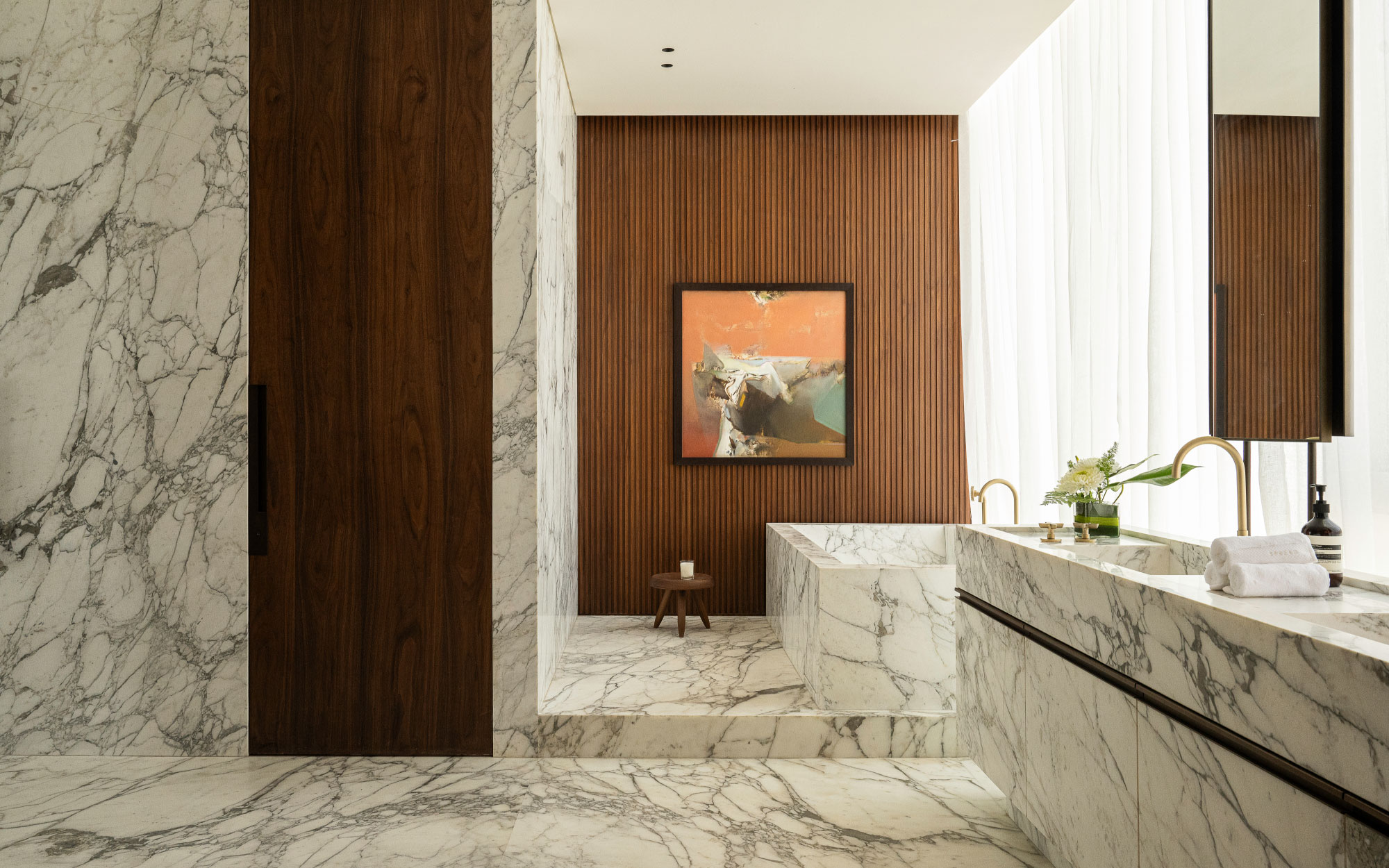 Another private retreat in one of the home’s primary suites is wrapped in plush marble. (Image Credit: Patricia Goijens)