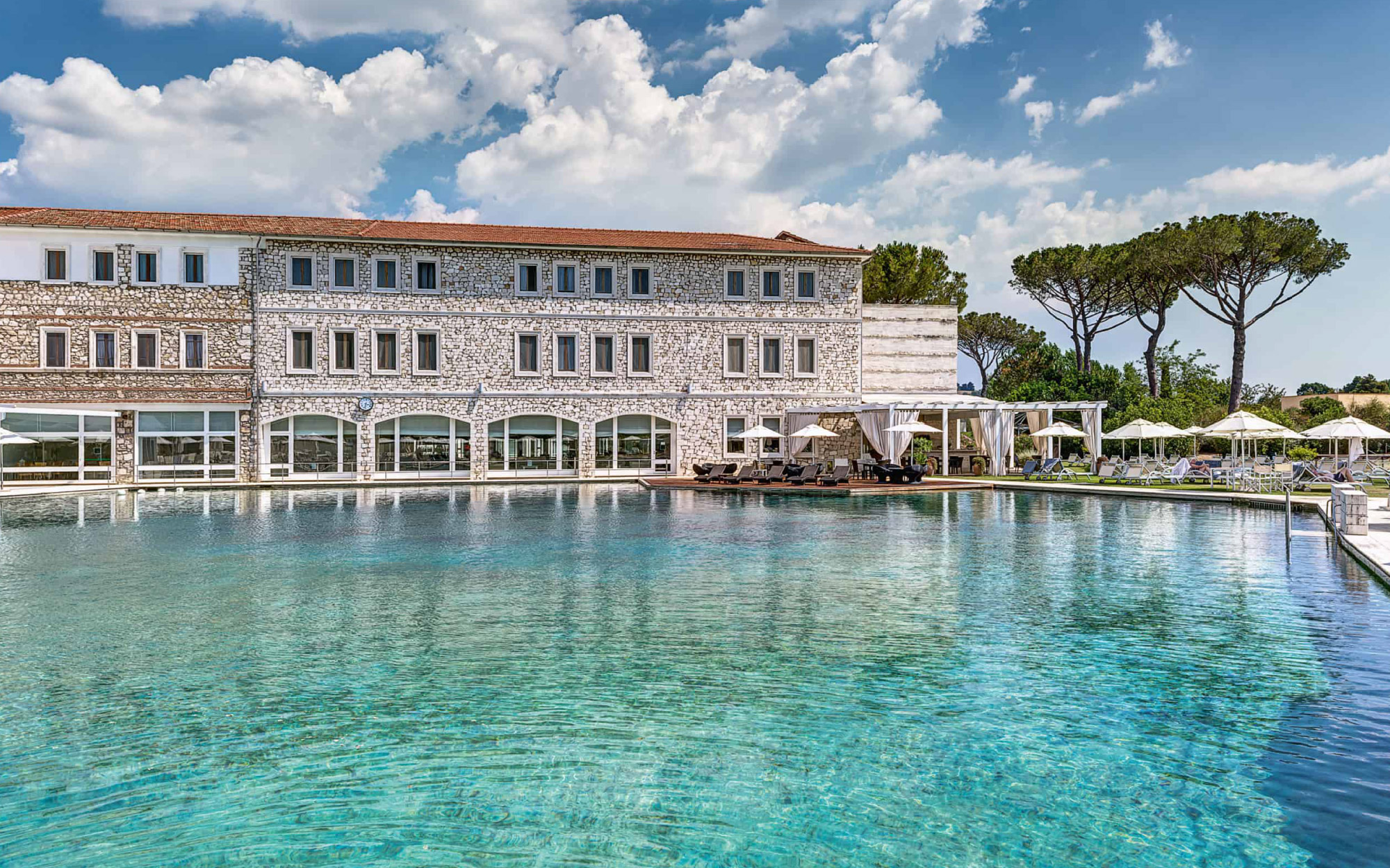 The day begins with the outdoor pool, a haven of sulphur-rich waters that have been flowing for over 3,000 years. (Image Credit: Terme di Saturnia)