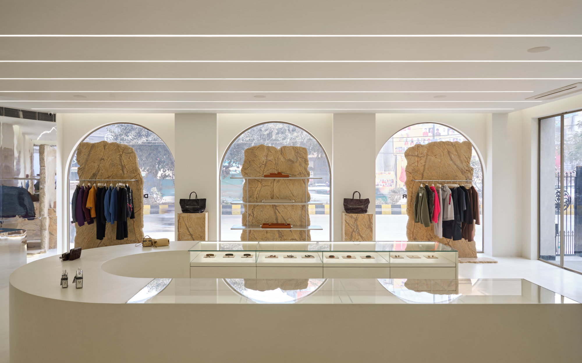 Raw marble surfaces are paired with seamless micro-concrete flooring, while glossy surfaces and mirror-finish walls subtly extend the sense of space. (Image Credits: Keith Ezekiel Joy)
