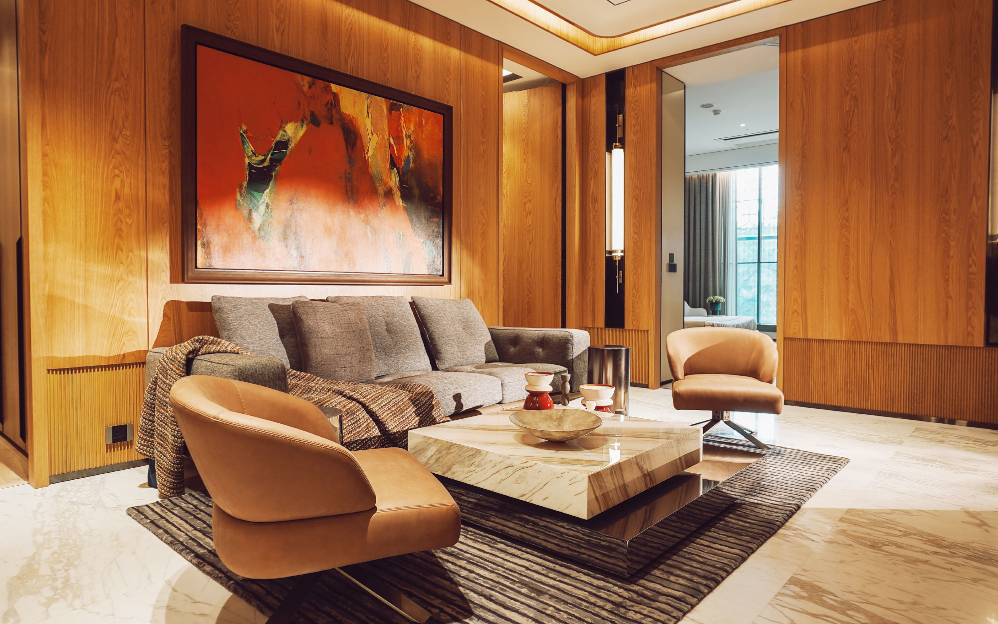 With wooden panels wrapping the walls and large marble slabs clad on the floor, the space is designed to be truly yours. (Image Credits: Kalpataru Limited)