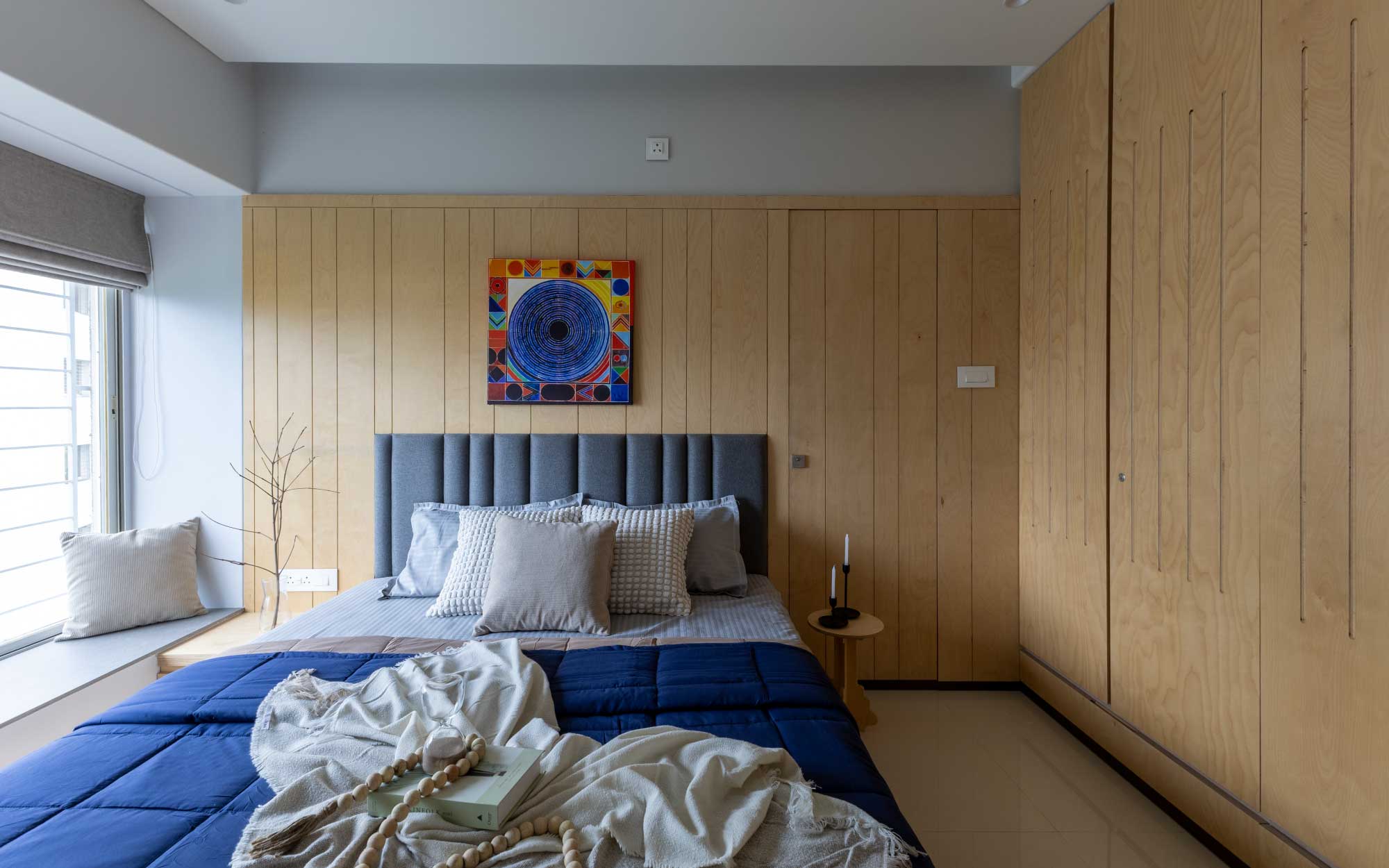 The bedrooms see a generous use of Birch wood. Vibrant artwork introduces vitality, a reminder that calm and energy can coexist. Furnishings from DDecor Diaries and the finishing paints from Birla Opus Clay Wash and Jotun Hygiene add a touch of subtle sophistication (Image Credits: Viveekajeet Purohit)