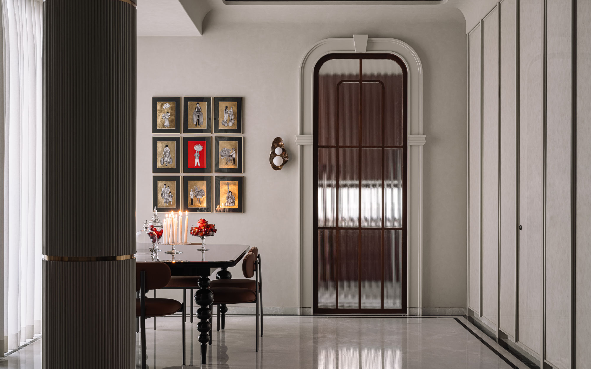 A contemporary space features an unexpected pop of red with a dining table by Blueloft, paired with dining chairs by Waulte. (Image Credits: Ishita Sitwala)